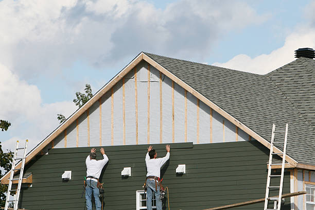 Professional Siding technician working in North Bend, OR